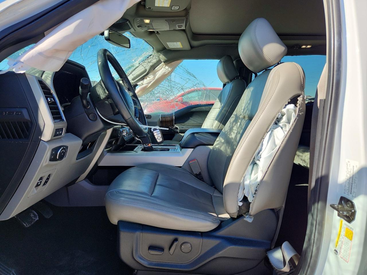 Interior — airbag deployment visible