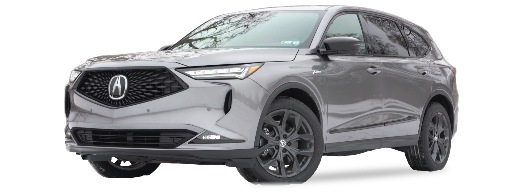 Grey Acura MDX (fourth generation) SUV, front three-quarter view, with the VIN locations marked