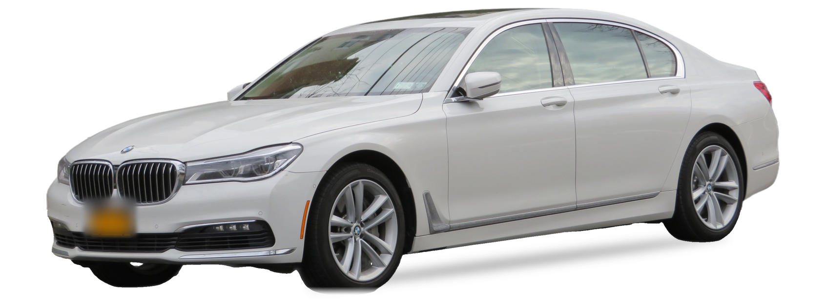 White BMW 7 Series (G12) sedan, front three-quarter view, with the VIN locations marked