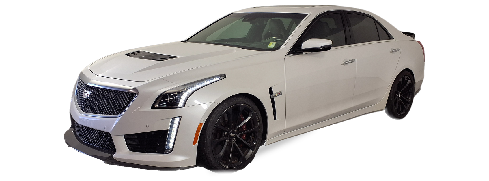 Silver Cadillac CTS (third generation) sedan, front three-quarter view, with the VIN locations marked