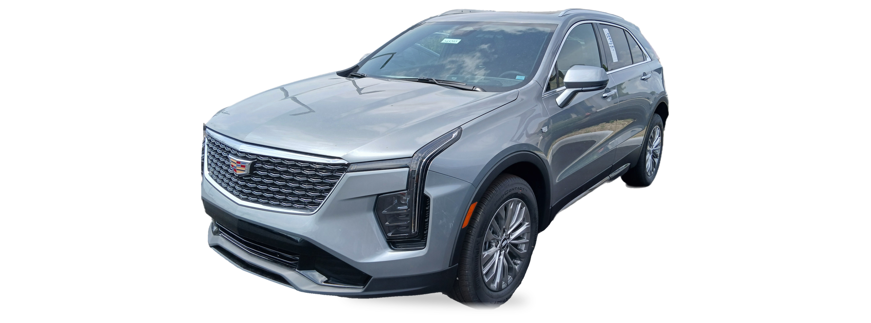 Silver-blue Cadillac XT4 (2024 facelift) crossover, front three-quarter view, with the VIN locations marked