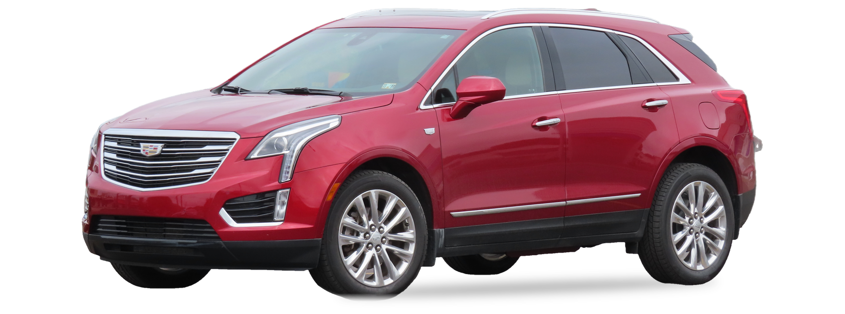 Red Cadillac XT5 (first generation) crossover, front three-quarter view, with the VIN locations marked