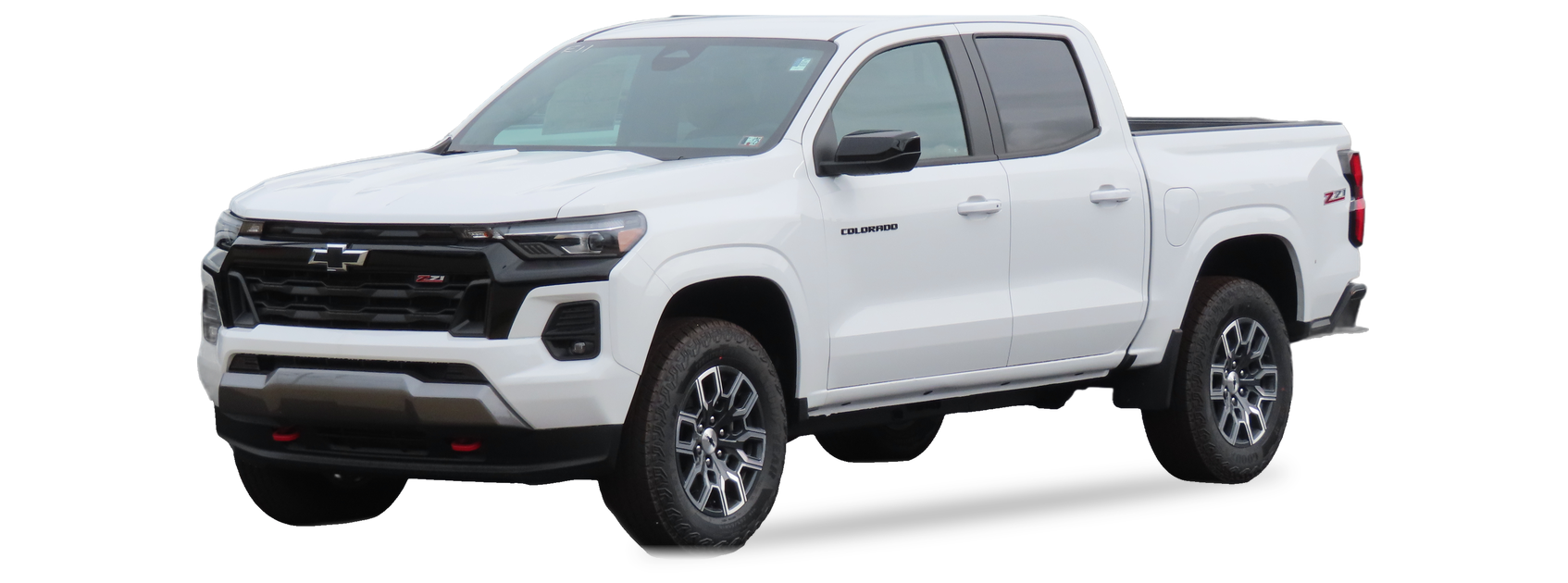 White Chevrolet Colorado (third generation) crew cab pickup, front three-quarter view, with the VIN locations marked