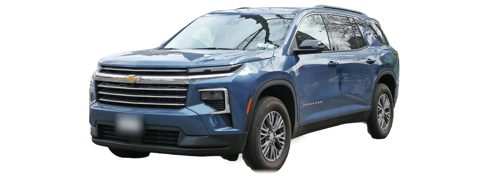 Blue Chevrolet Traverse (third generation) SUV, front three-quarter view, with the VIN locations marked