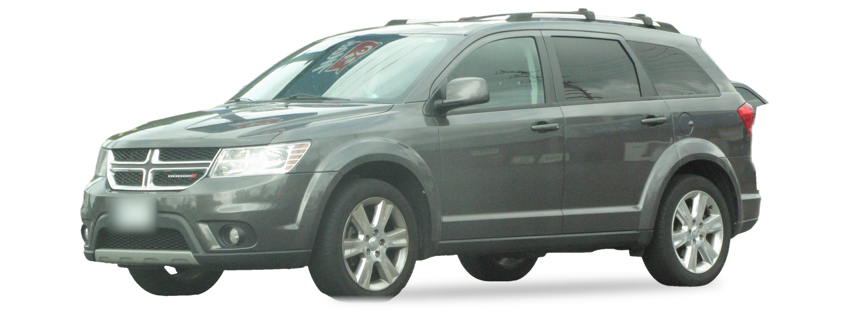 Dark grey Dodge Journey (first generation) crossover, front three-quarter view, with the VIN locations marked