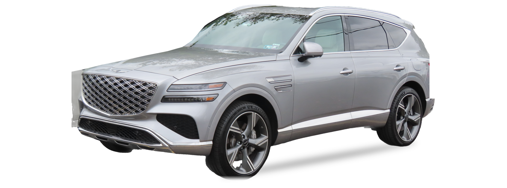 Silver Genesis GV80 (2025 facelift) SUV, front three-quarter view, with the VIN locations marked