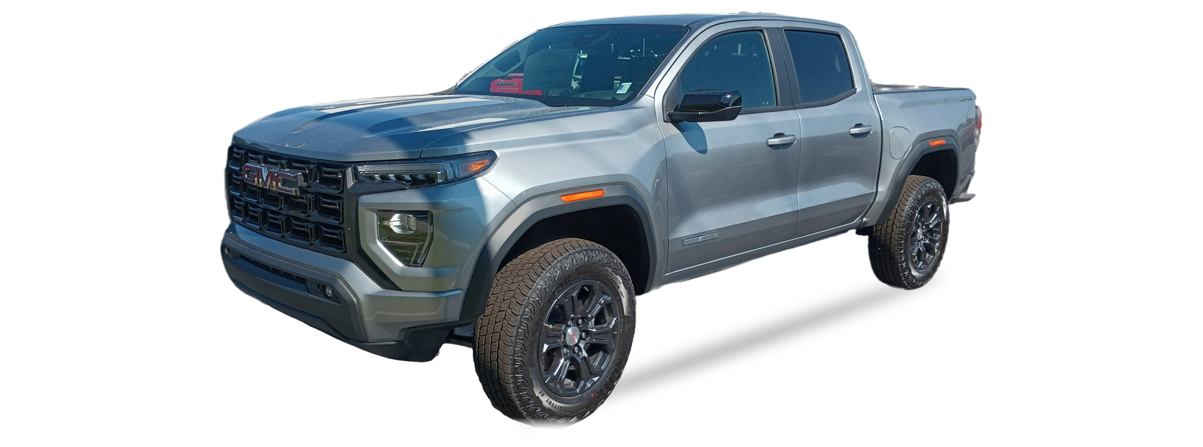 GMC Canyon plateado (tercera generación), pickup doble cabina, vista frontal de tres cuartos, con las ubicaciones del VIN marcadas