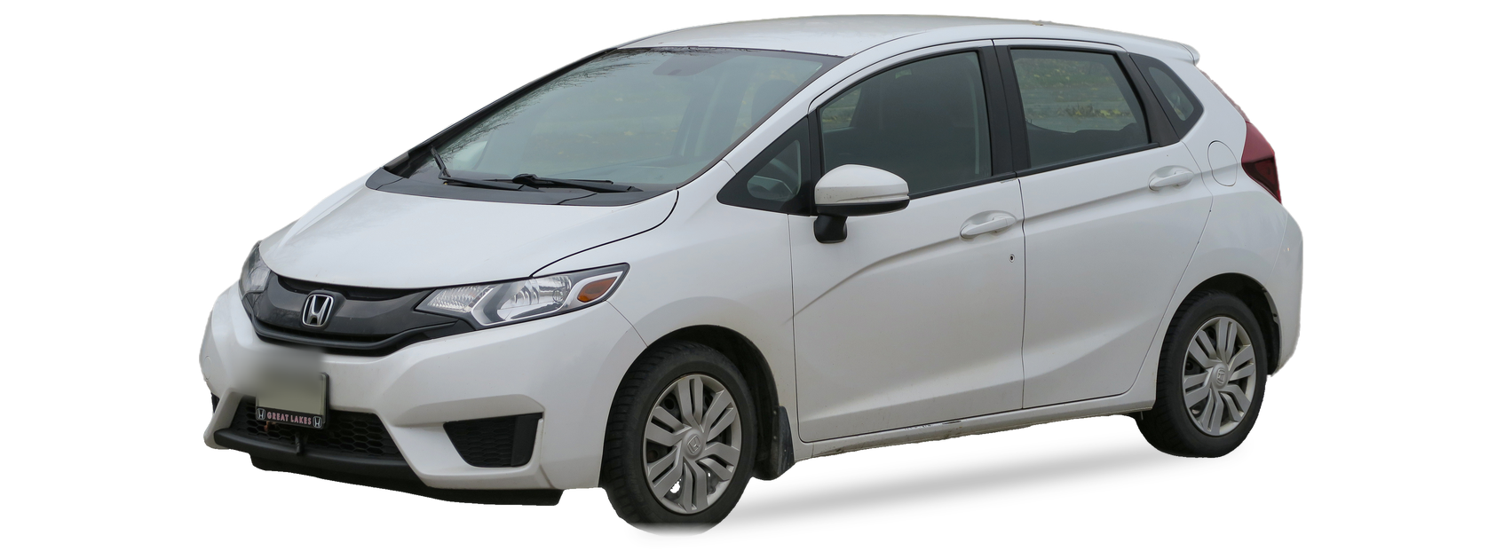 White Honda Fit (third generation) hatchback, front three-quarter view, with the VIN locations marked