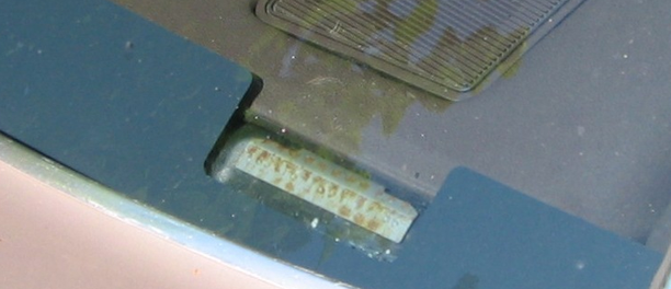 VIN plate seen through the windshield