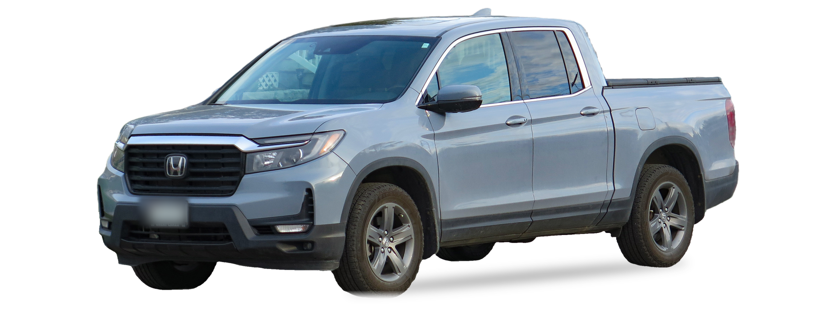 Grey Honda Ridgeline (second generation) crew cab pickup, front three-quarter view, with the VIN locations marked