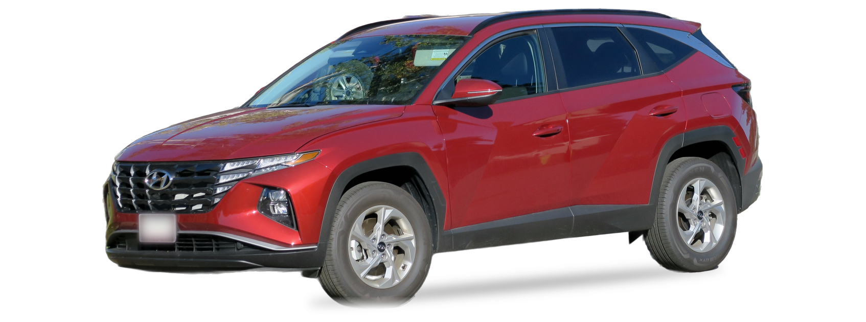 Red Hyundai Tucson (fourth generation) SUV, front three-quarter view, with the VIN locations marked