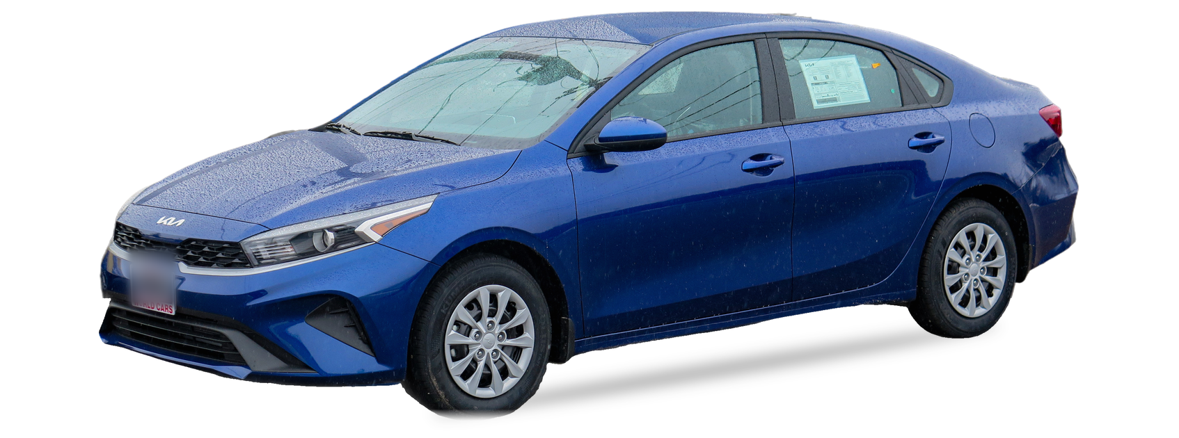 Blue Kia Forte (third generation) sedan, front three-quarter view, with the VIN locations marked
