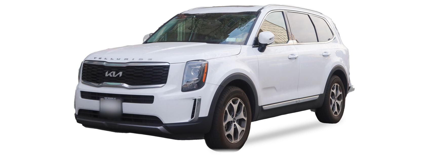 White Kia Telluride (first generation) SUV, front three-quarter view, with the VIN locations marked