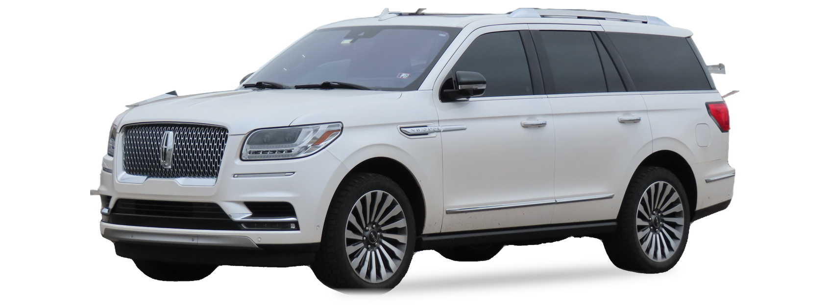 White Lincoln Navigator (fourth generation) SUV, front three-quarter view, with the VIN locations marked