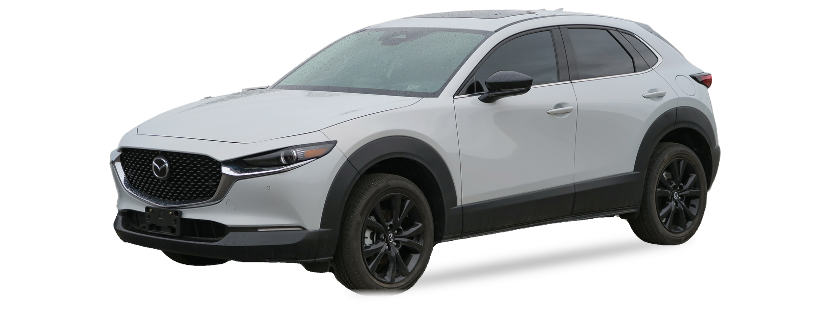 Mazda CX-30 gris claro (primera generación), SUV, vista frontal de tres cuartos, con las ubicaciones del VIN marcadas