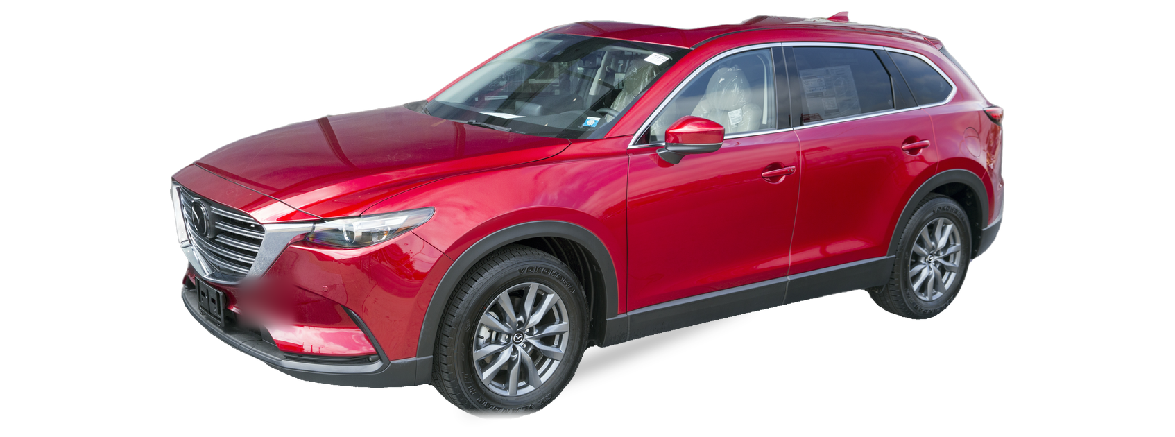 Red Mazda CX-9 (second generation) SUV, front three-quarter view, with the VIN locations marked