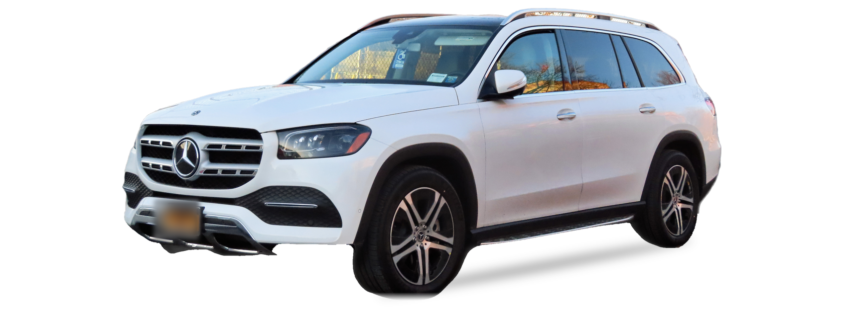 White Mercedes-Benz GLS (second generation) SUV, front three-quarter view, with the VIN locations marked