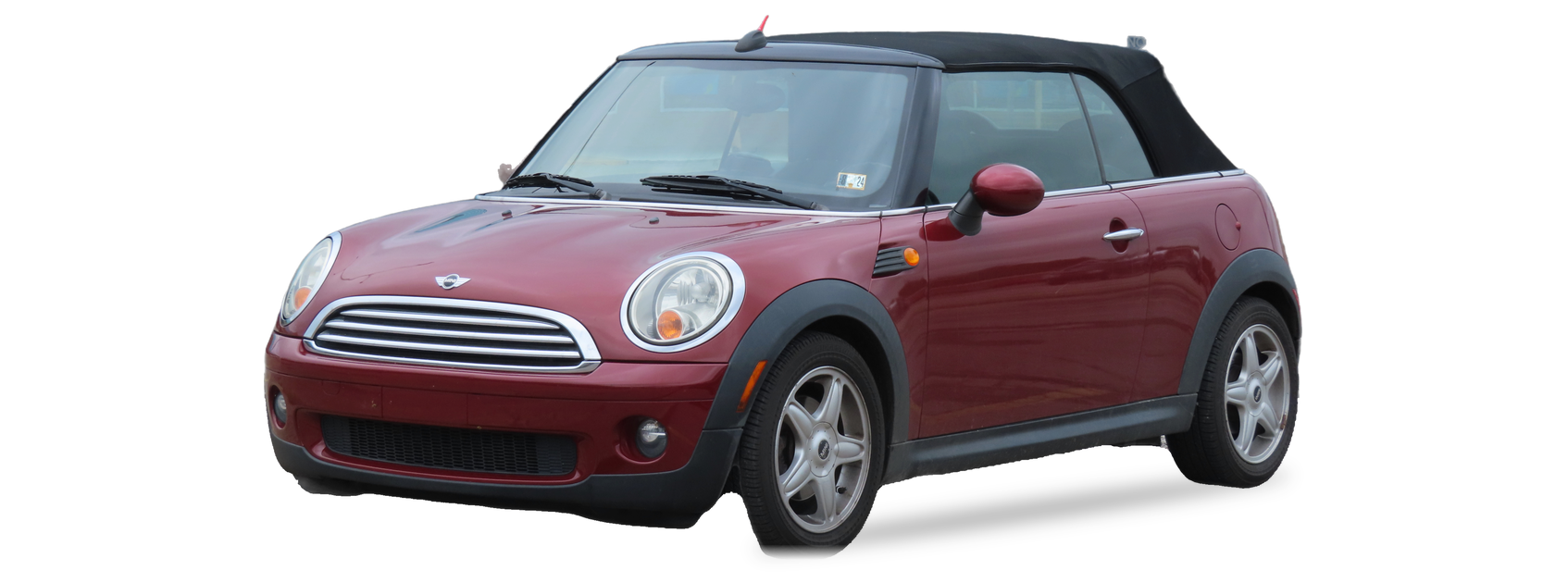 Red MINI Convertible (second generation) convertible, front three-quarter view, with the VIN locations marked