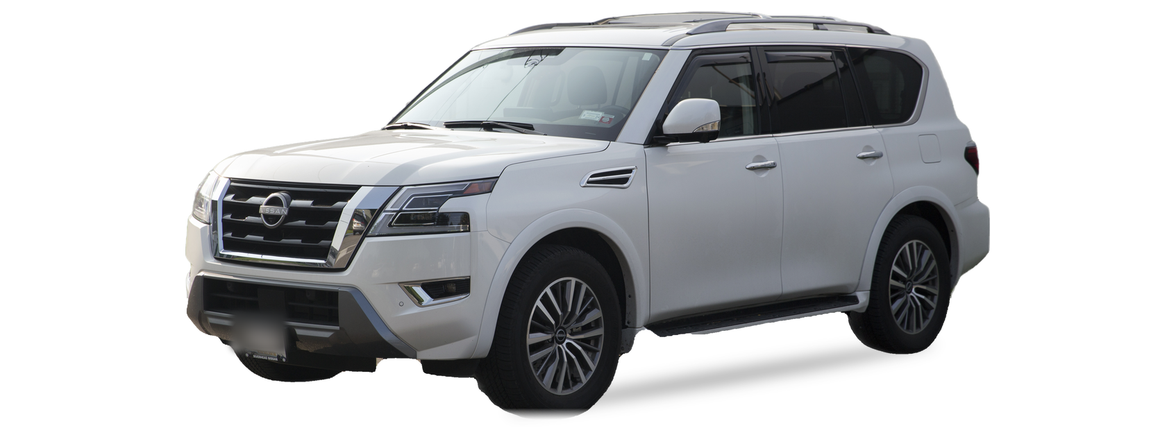 White Nissan Armada (second generation) SUV, front three-quarter view, with the VIN locations marked