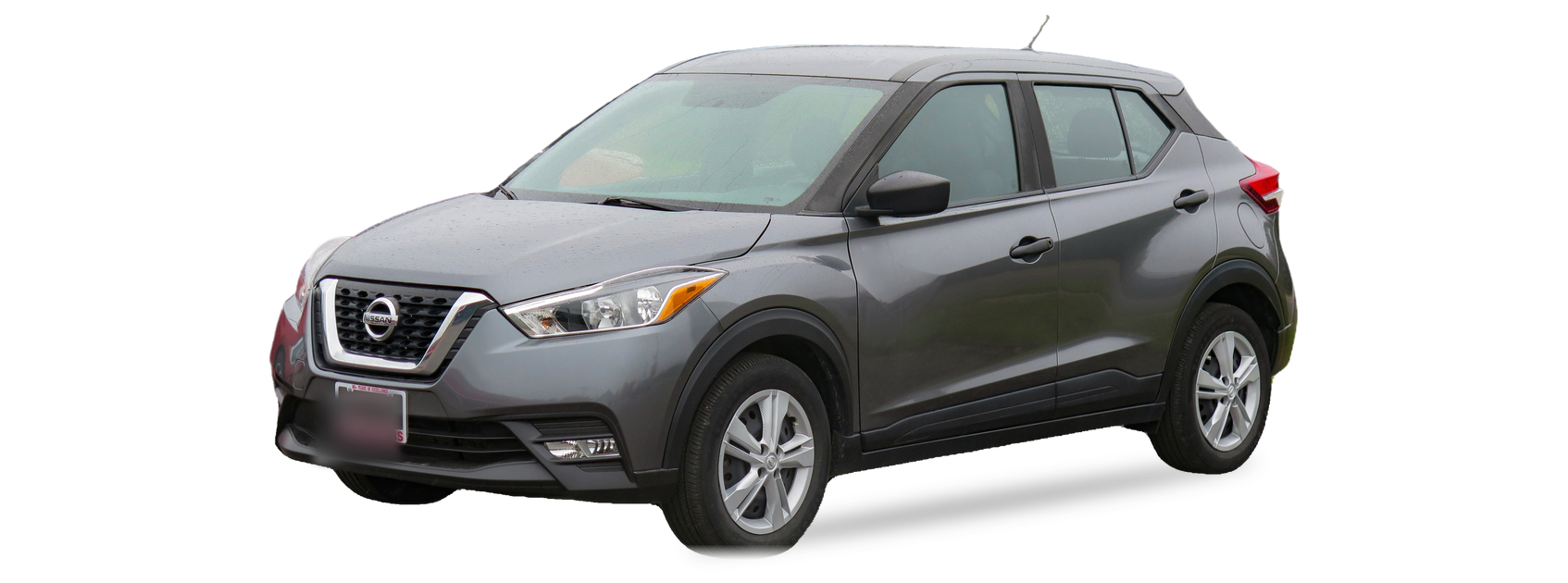 Gray Nissan Kicks (first generation) SUV, front three-quarter view, with the VIN locations marked