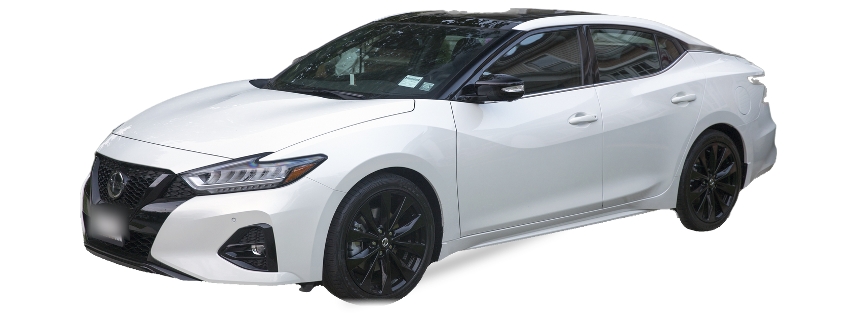 White Nissan Maxima (eighth generation) sedan, front three-quarter view, with the VIN locations marked