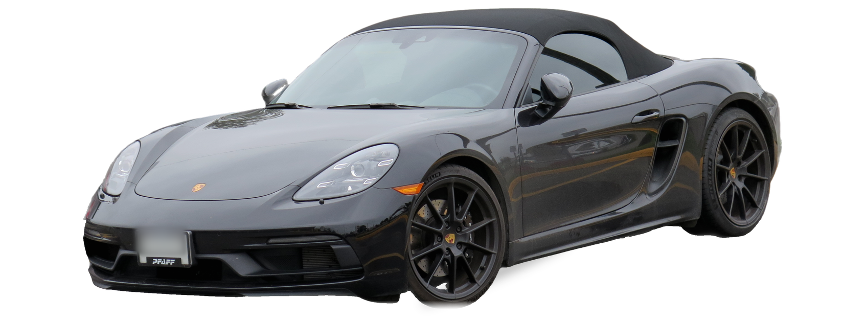 Porsche Boxster negro (cuarta generación), descapotable, vista frontal de tres cuartos, con las ubicaciones del VIN marcadas