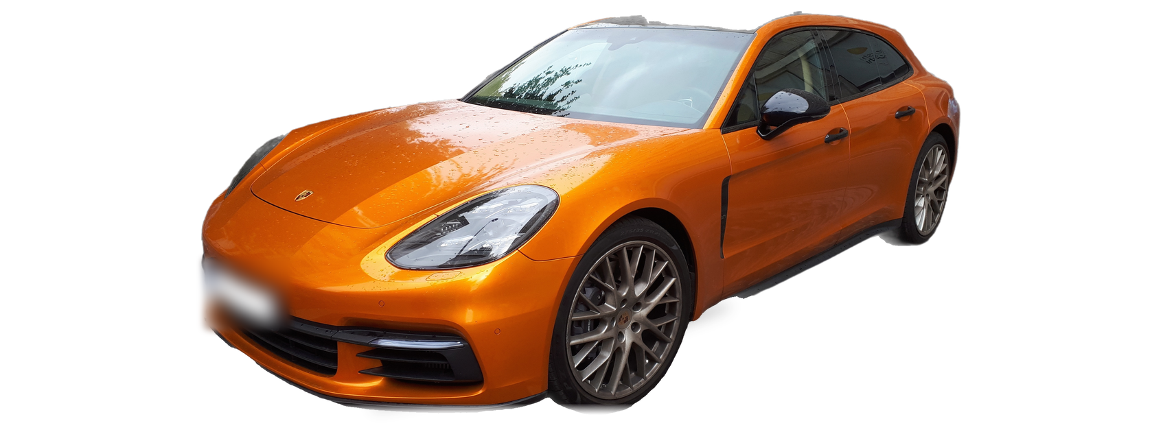 Orange Porsche Panamera (second generation) wagon, front three-quarter view, with the VIN locations marked