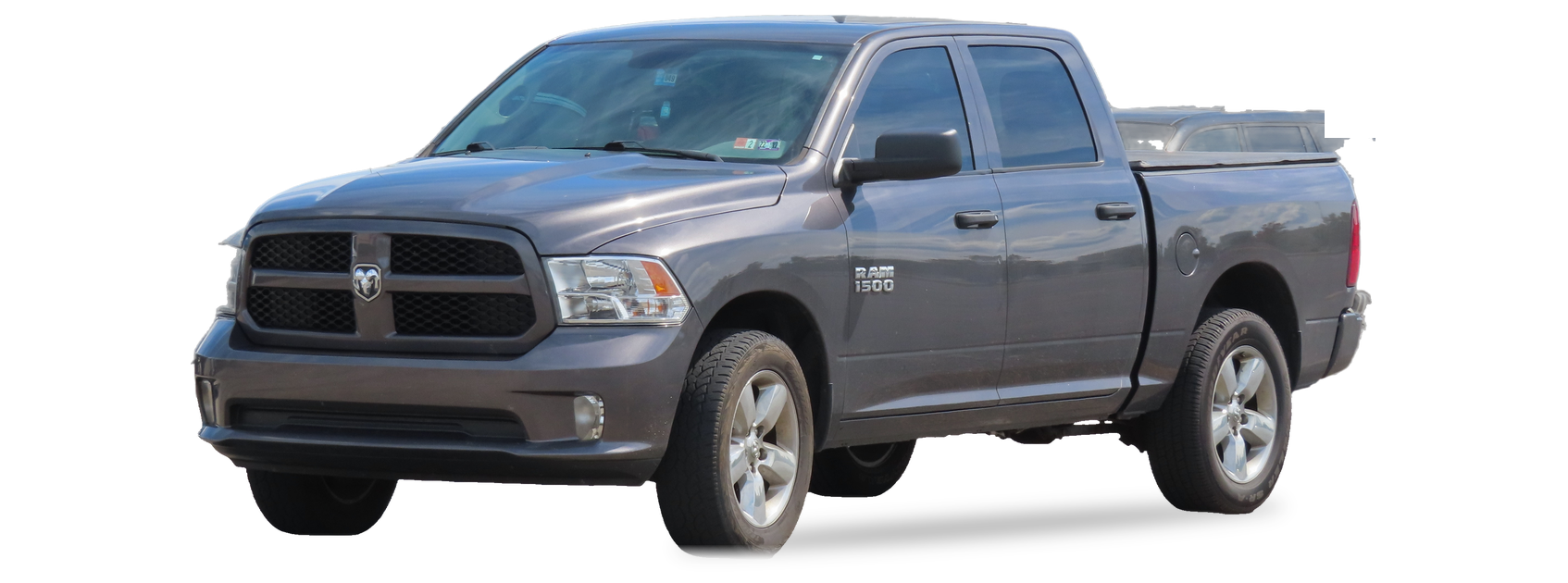 Gray Ram 1500 Classic (fourth generation) crew cab pickup, front three-quarter view, with the VIN locations marked