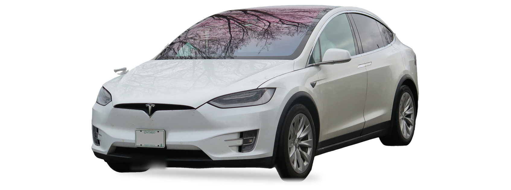 Tesla Model X blanco (primera generación), SUV, vista frontal de tres cuartos, con las ubicaciones del VIN marcadas
