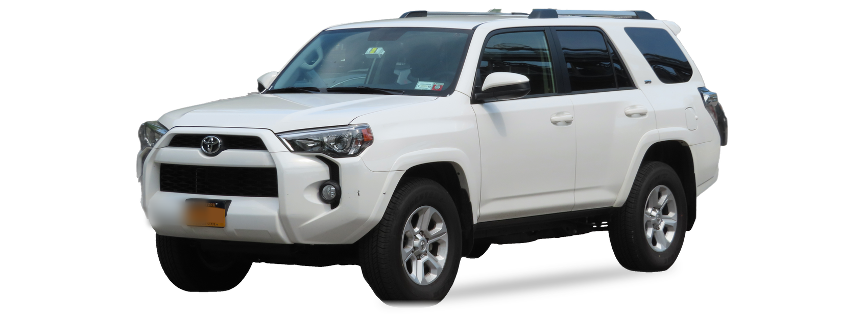 White Toyota 4Runner (fifth generation) SUV, front three-quarter view, with the VIN locations marked