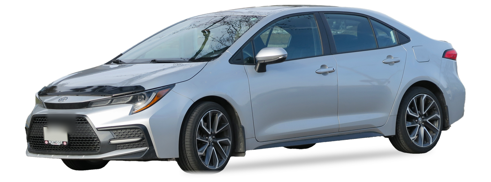 Silver Toyota Corolla (twelfth generation) sedan, front three-quarter view, with the VIN locations marked