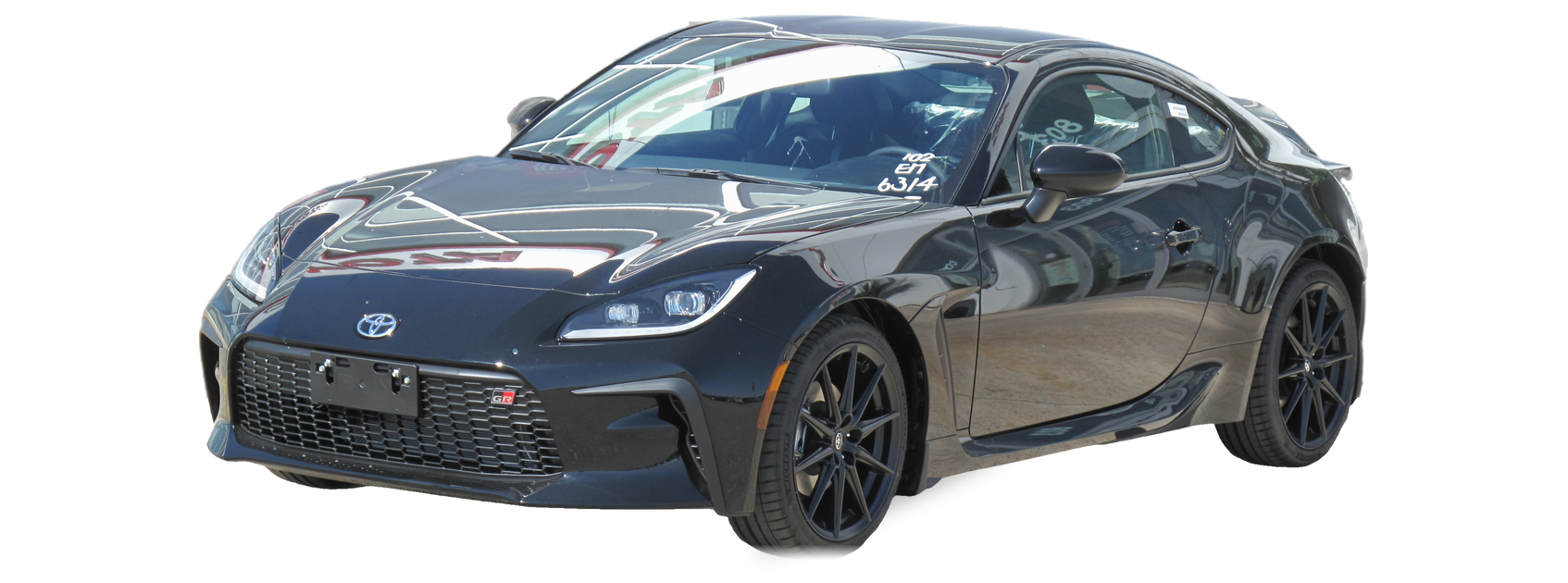 Black Toyota GR86 (second generation) coupe, front three-quarter view, with the VIN locations marked