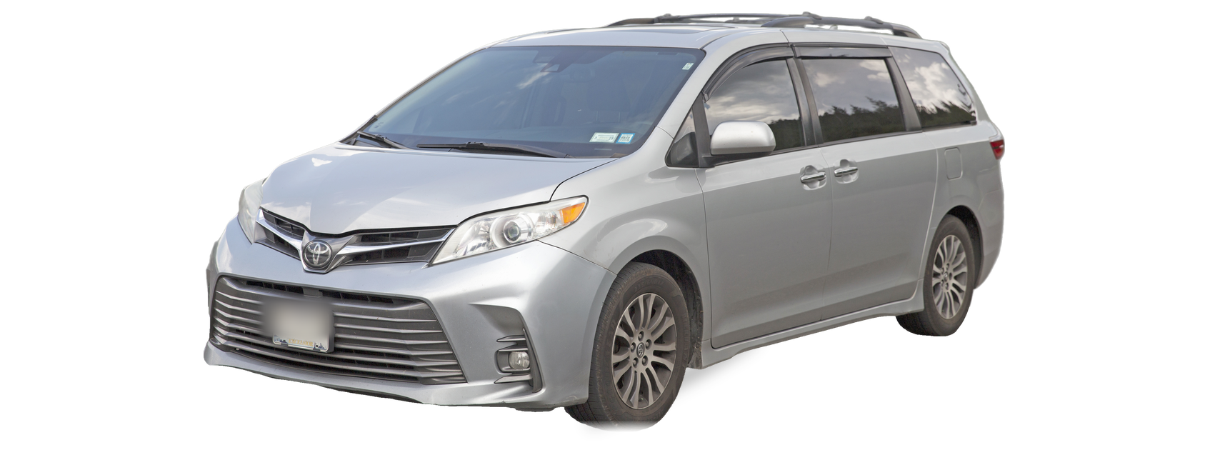 Silver Toyota Sienna (third generation) minivan, front three-quarter view, with the VIN locations marked