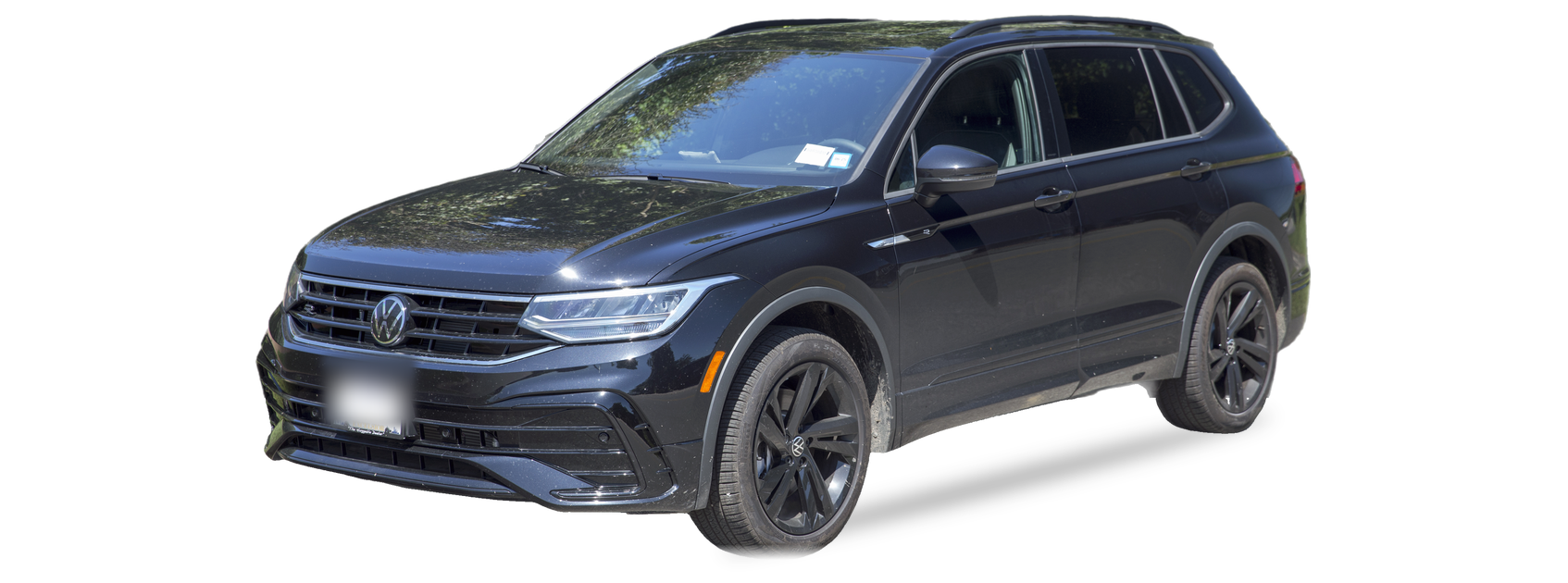 Black Volkswagen Tiguan (second generation) SUV, front three-quarter view, with the VIN locations marked