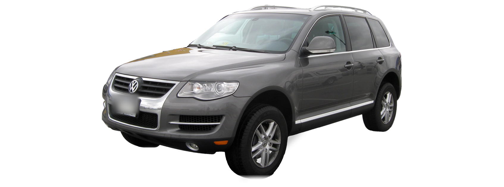Gray Volkswagen Touareg (first generation) SUV, front three-quarter view, with the VIN locations marked