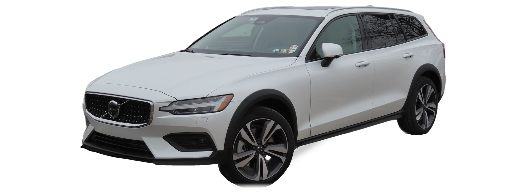 White Volvo V60 (second generation) crossover wagon, front three-quarter view, with the VIN locations marked